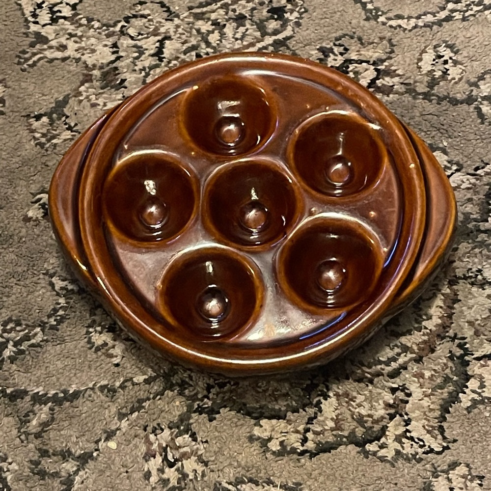 Escargot, mushroom caps, quail eggs and more dish